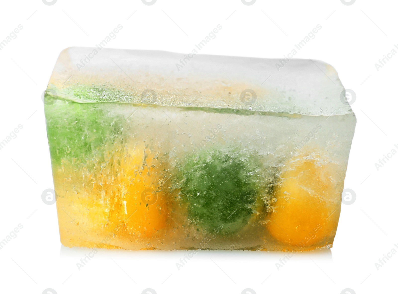 Photo of Corn grains and green peas in ice cube on white background. Frozen vegetables