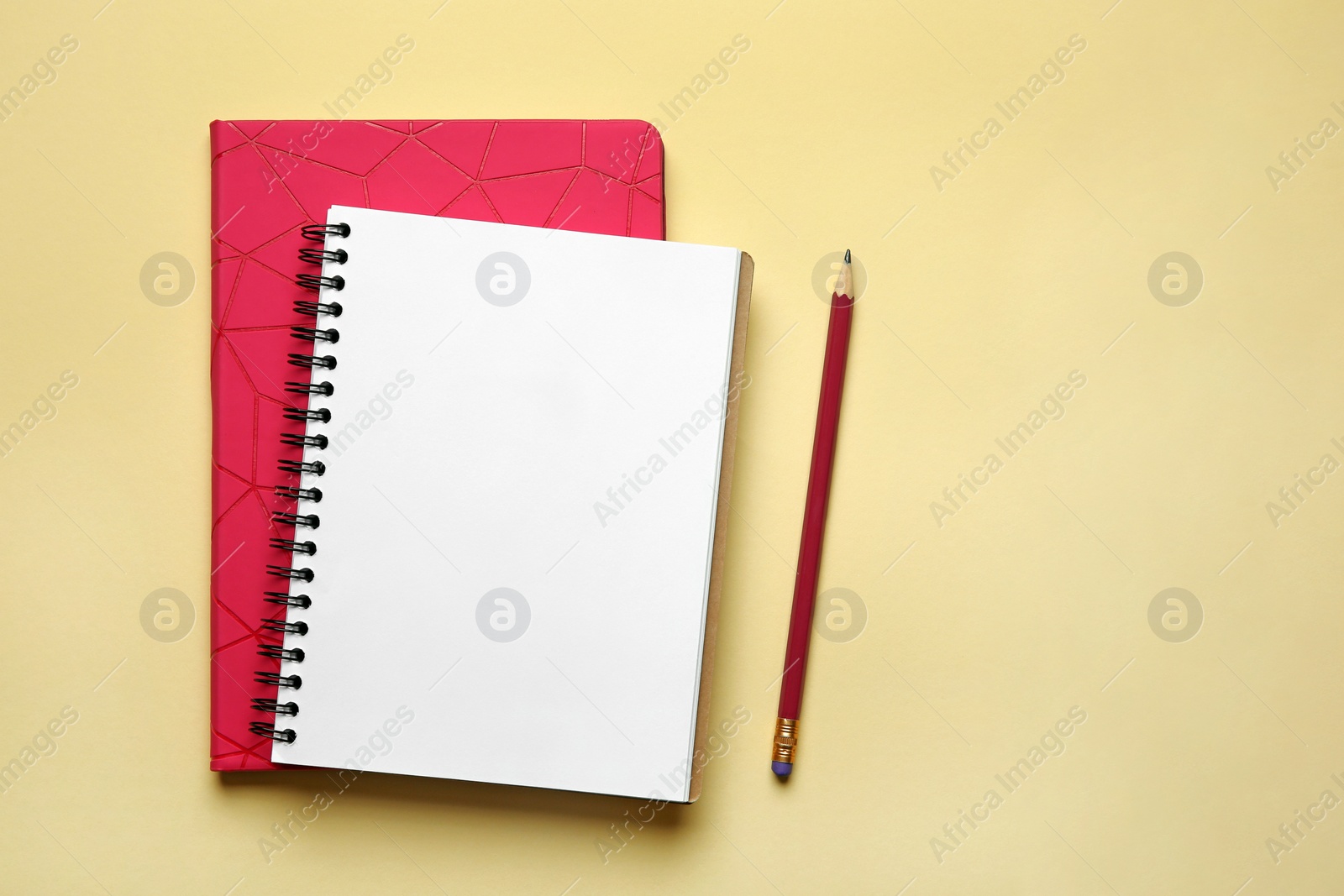 Photo of Flat lay composition with office stationery on beige background. Space for design