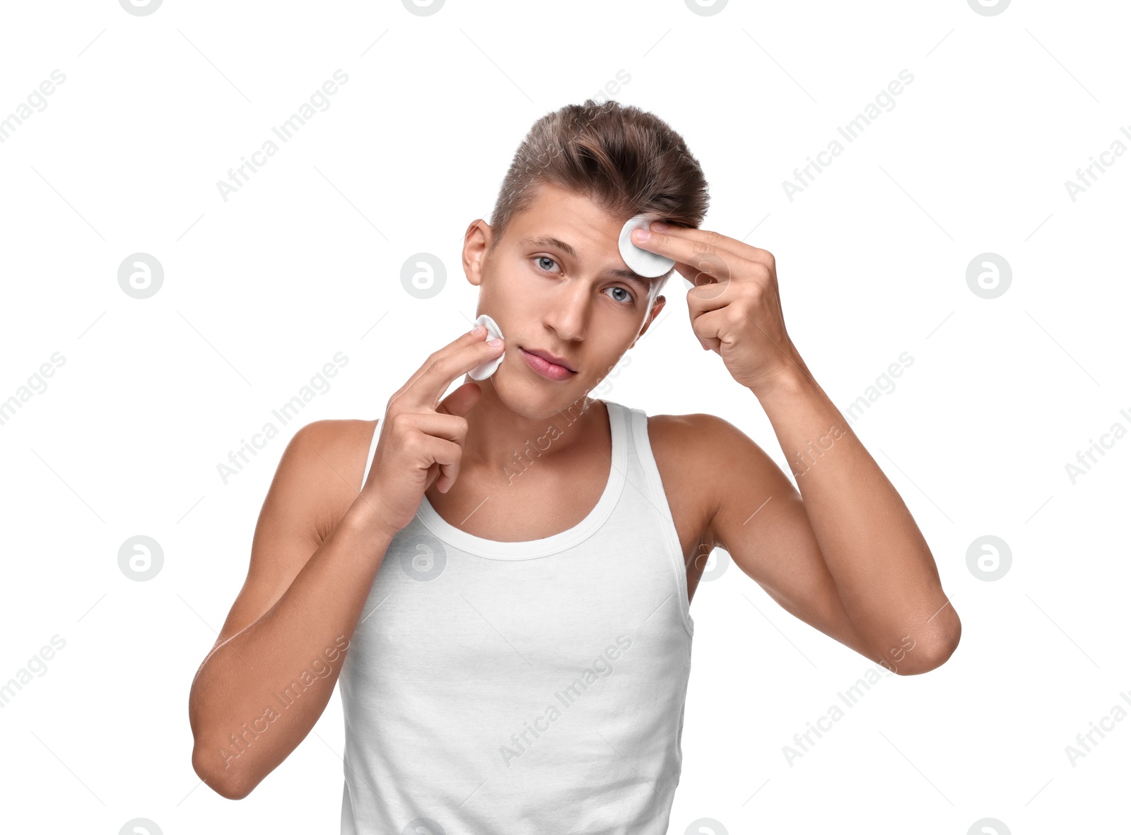 Photo of Handsome man with cotton pads on white background