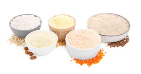 Photo of Different types of flour in bowls on white background