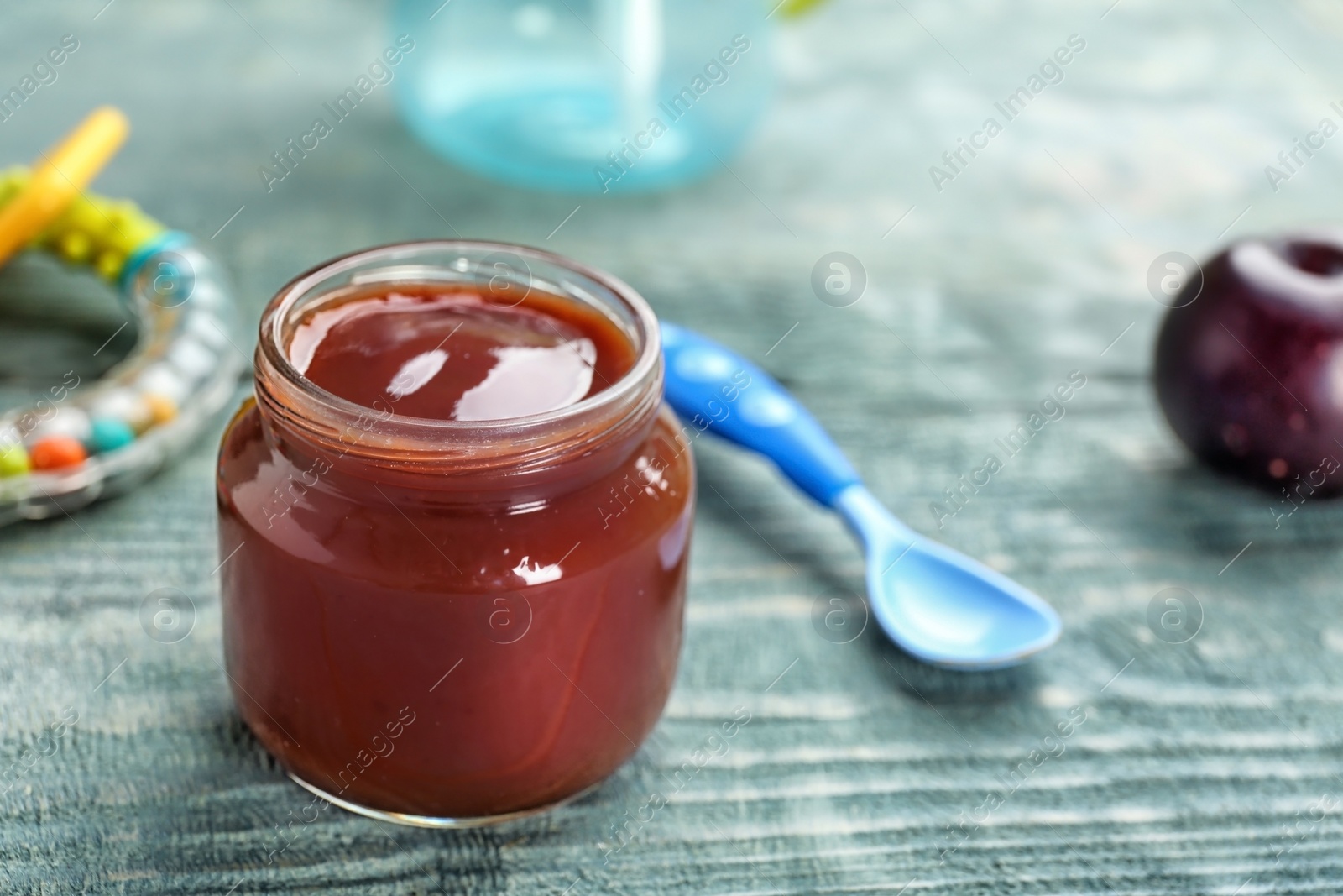 Photo of Jar with healthy baby food on table