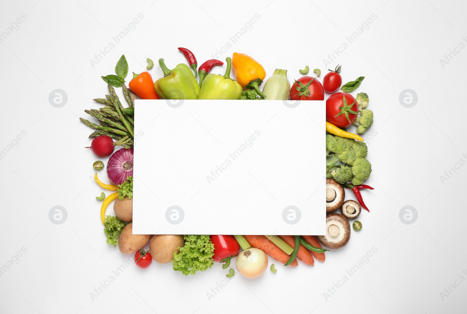 Photo of Blank card and fresh vegetables on white background, flat lay. Space for text