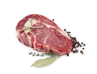 Photo of Piece of fresh beef meat, herbs and spices on white background