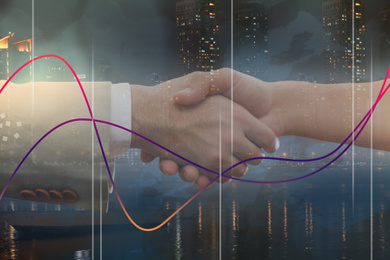 Image of Double exposure of people shaking hands and night cityscape, closeup. Stock exchange trading