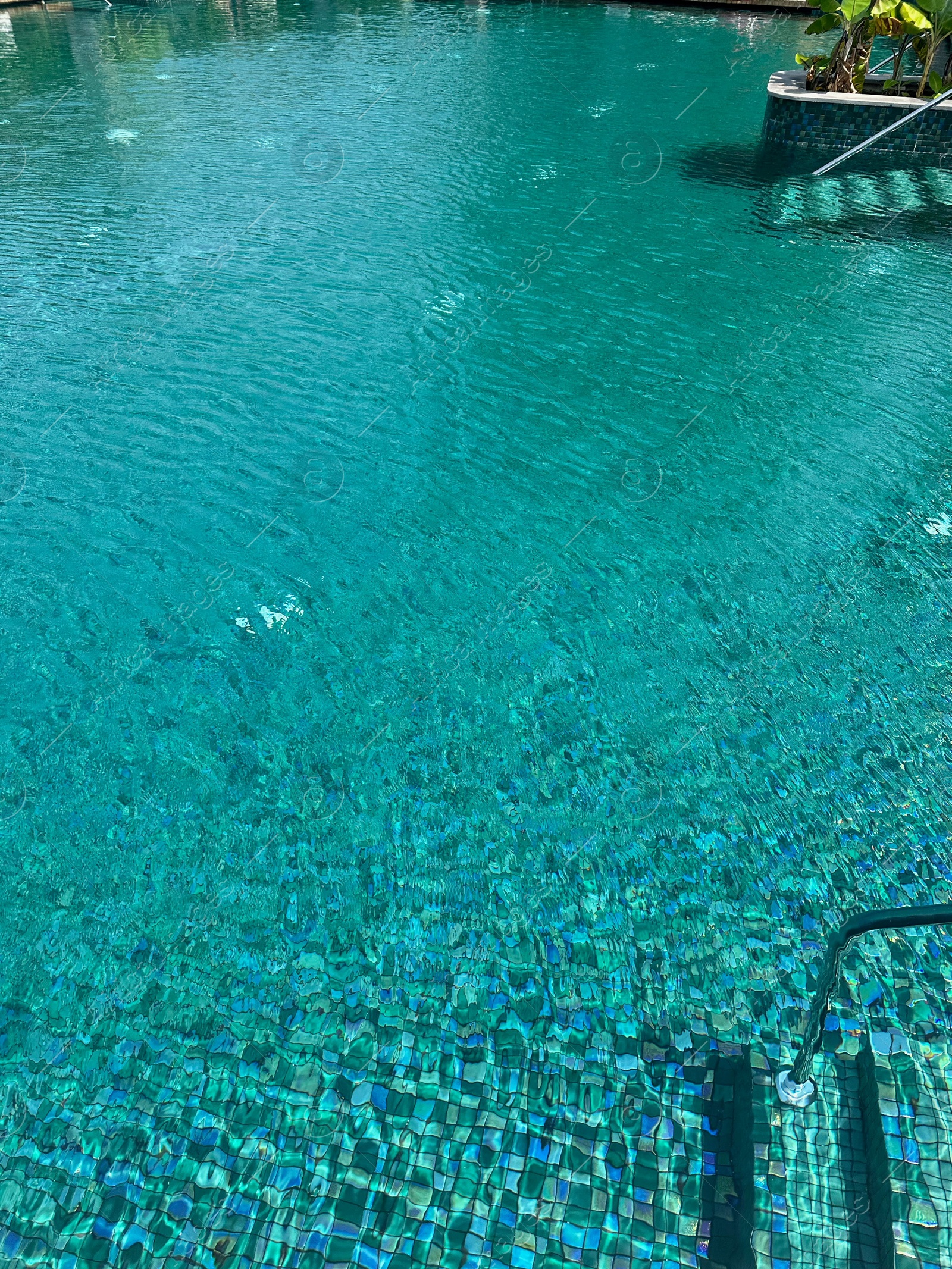 Photo of Clear water in outdoor swimming pool on sunny day