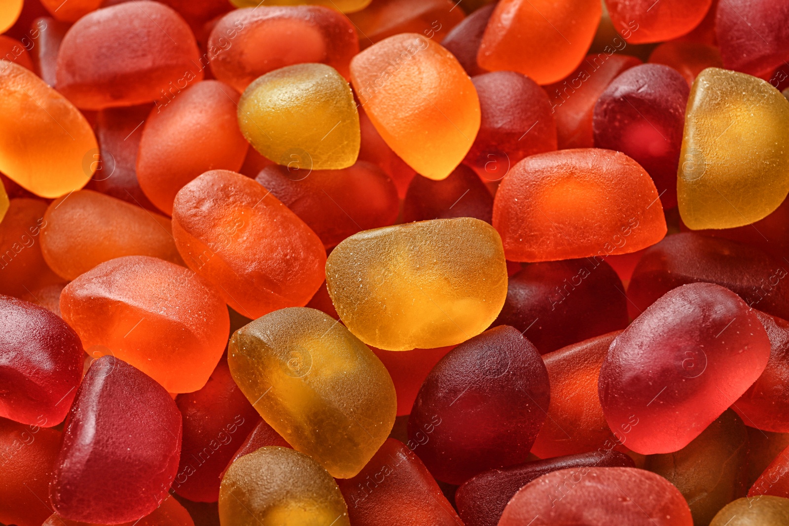 Photo of Sweet color jelly candies as background, closeup