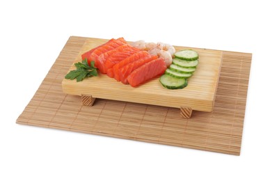 Photo of Delicious sashimi set of salmon and shrimps served with cucumbers and parsley isolated on white