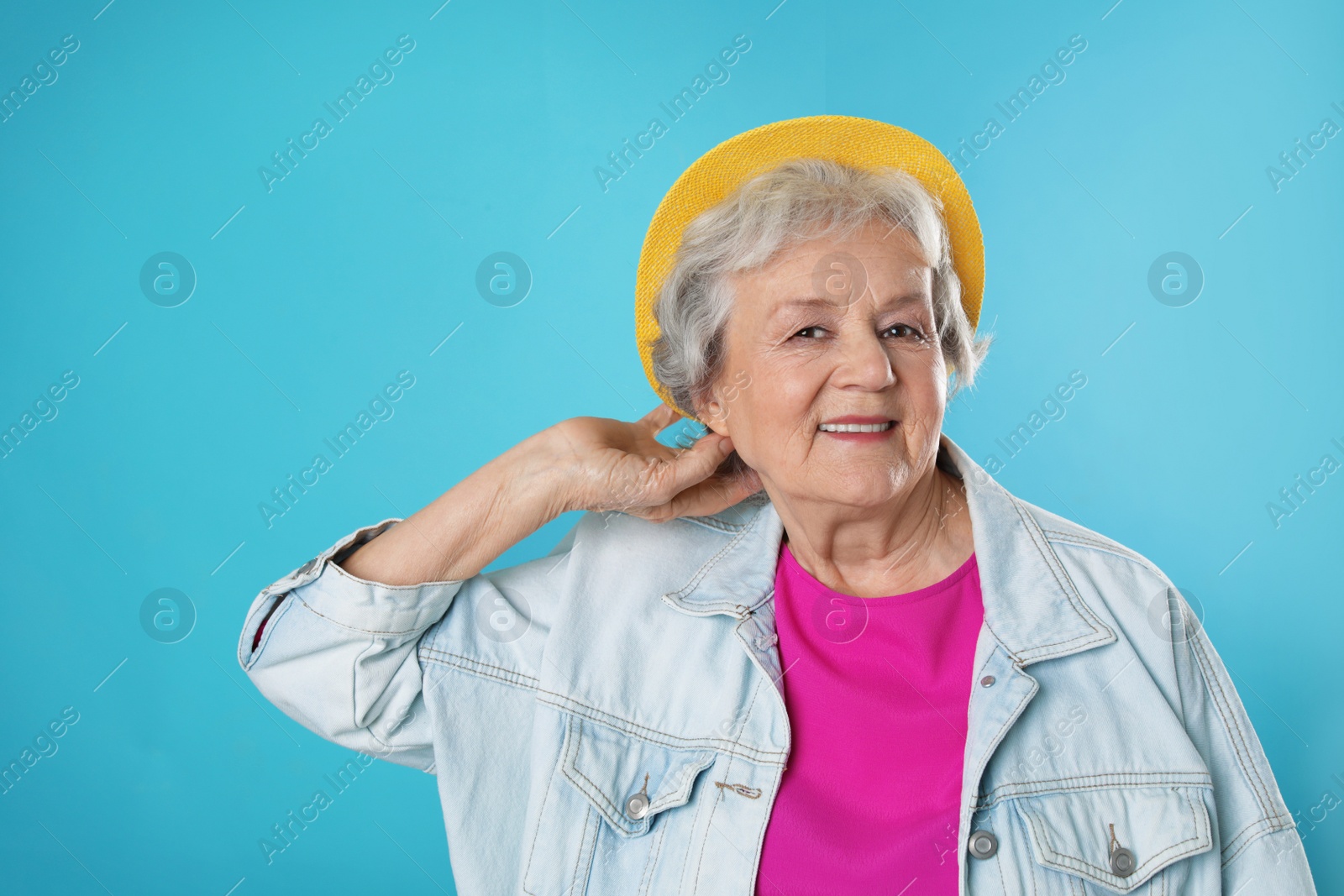 Photo of Portrait of mature woman in hipster outfit on color background