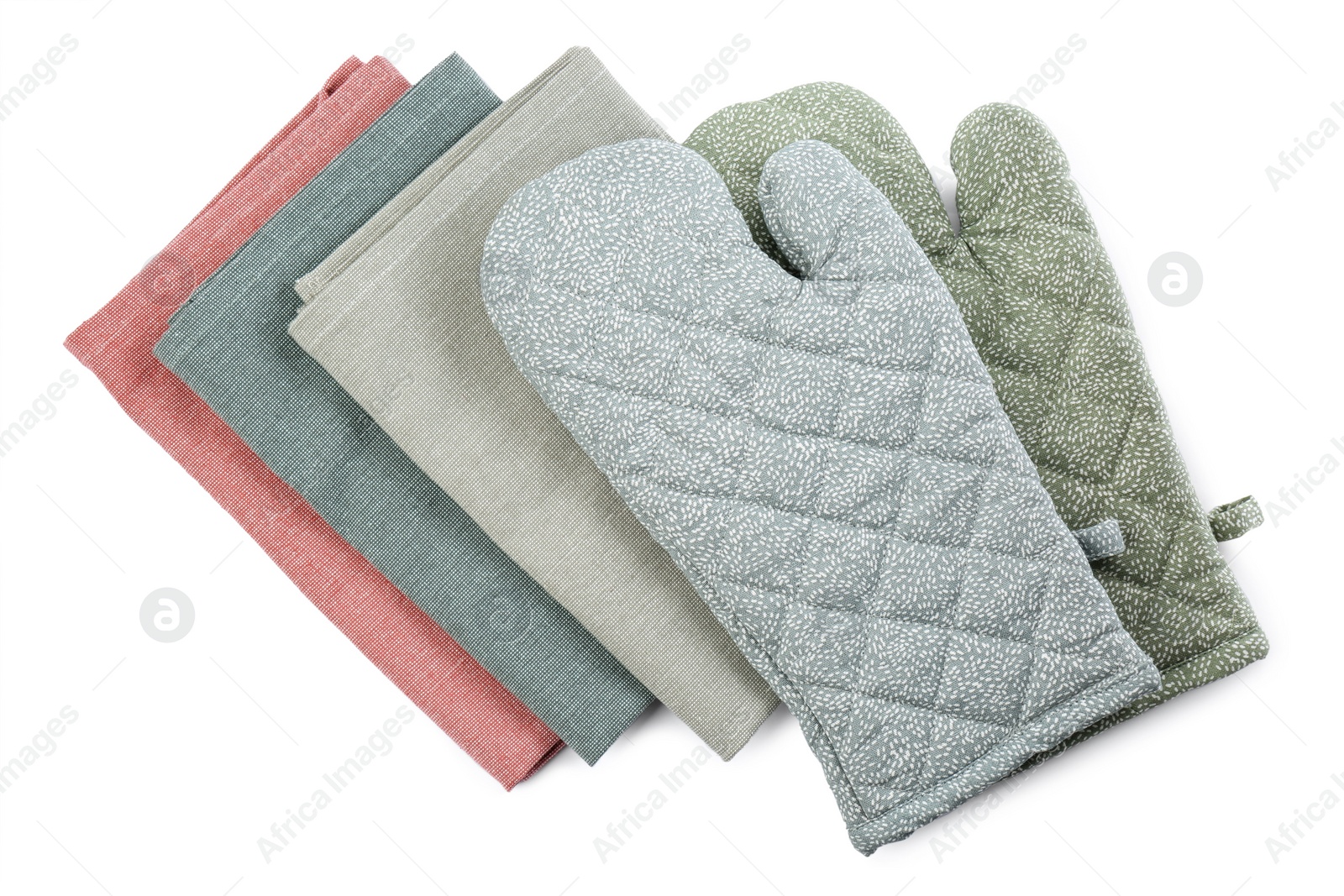 Photo of Kitchen towels and oven gloves for hot dishes on white background, top view