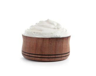 Photo of Wooden bowl with fresh sour cream isolated on white