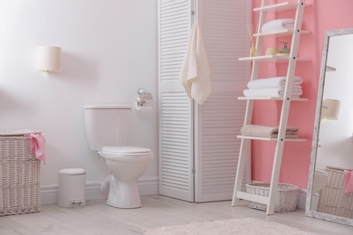 Photo of Toilet bowl in modern bathroom interior