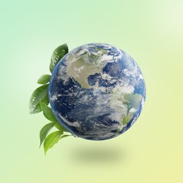 Image of Recycling concept. Earth planet with green leaves on light background
