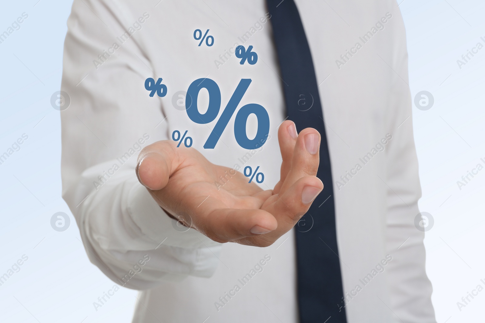 Image of Man showing virtual percent sign on white background, closeup. Discount concept