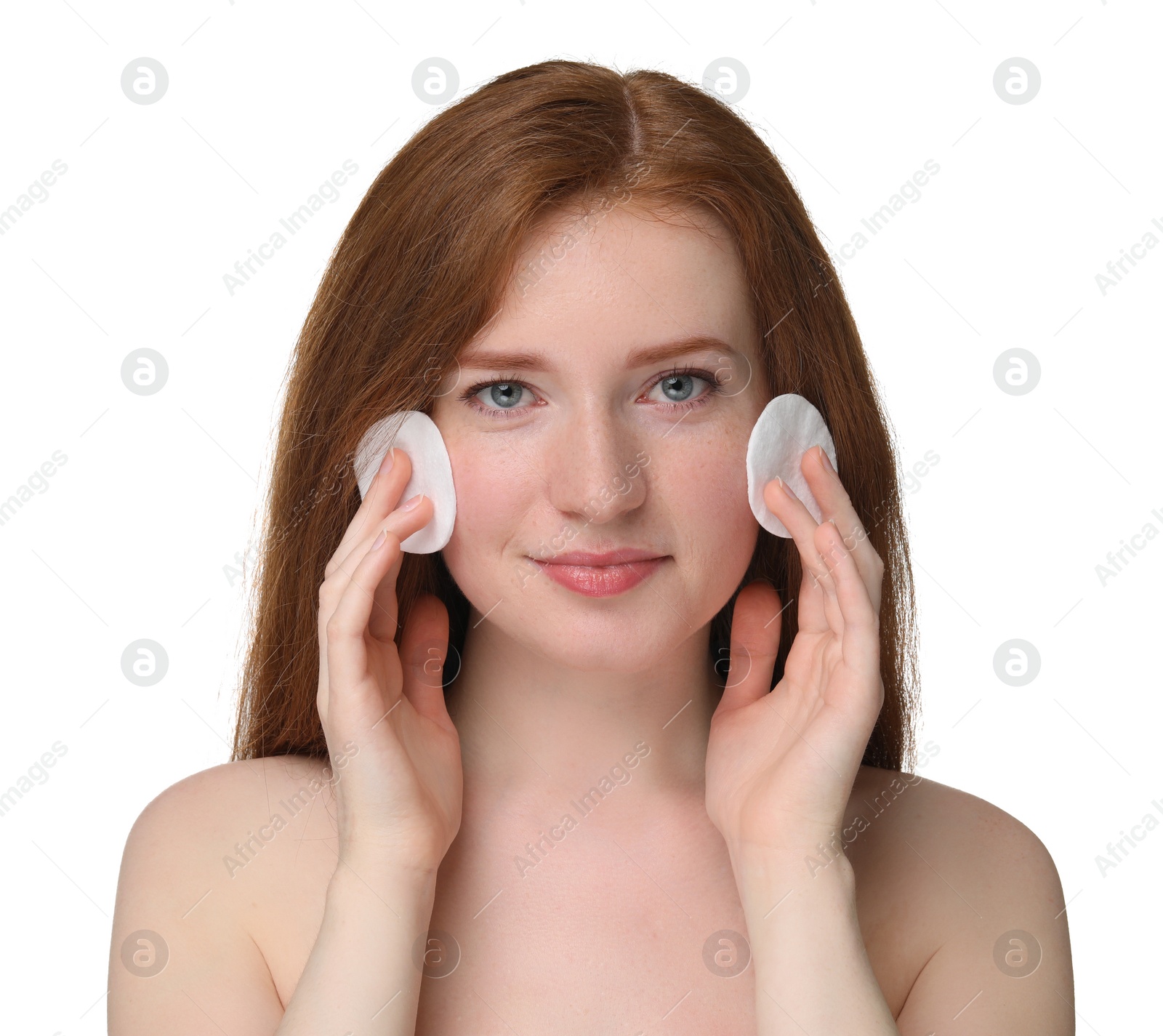 Photo of Beautiful woman with freckles wiping face on white background