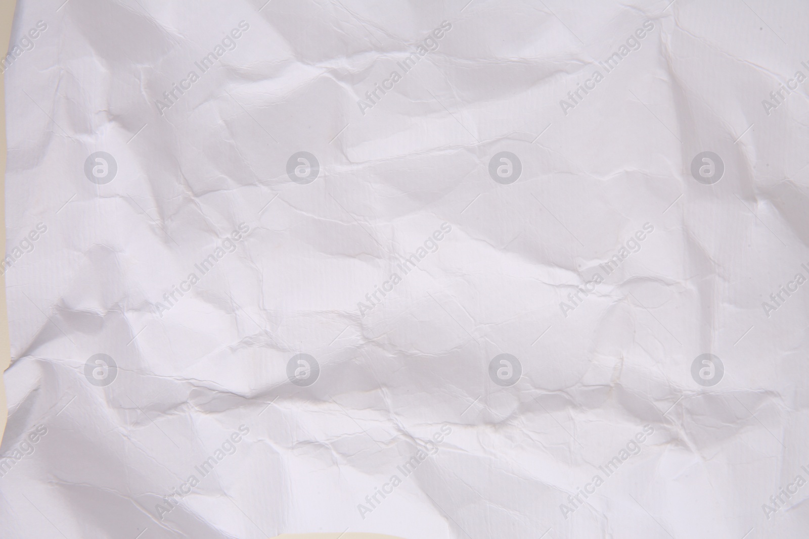 Photo of Texture of crumpled parchment paper as background, top view