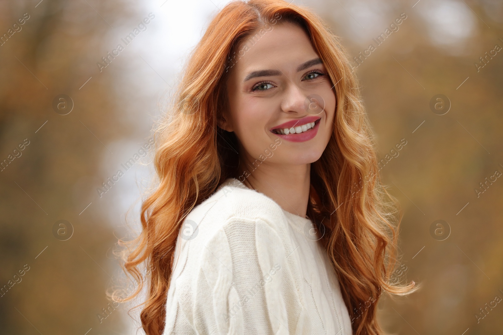 Photo of Autumn vibes. Portrait of smiling woman outdoors