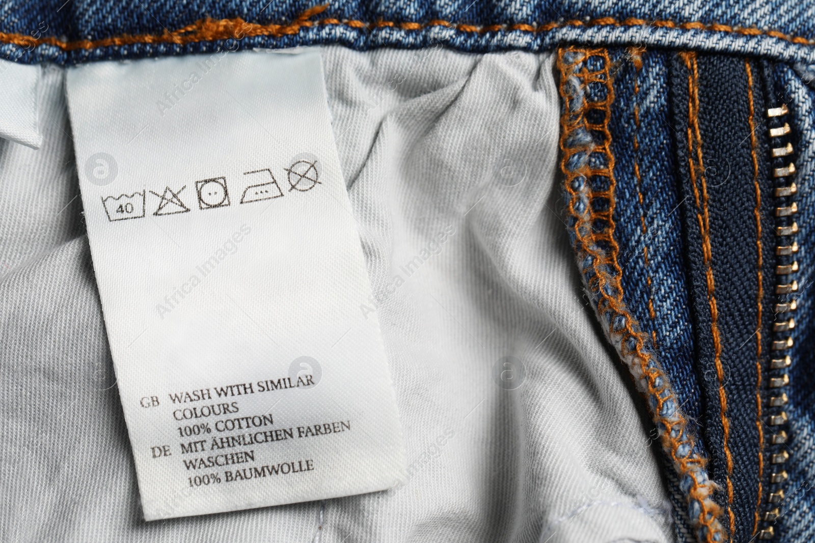 Photo of Clothing label on jeans garment, closeup view