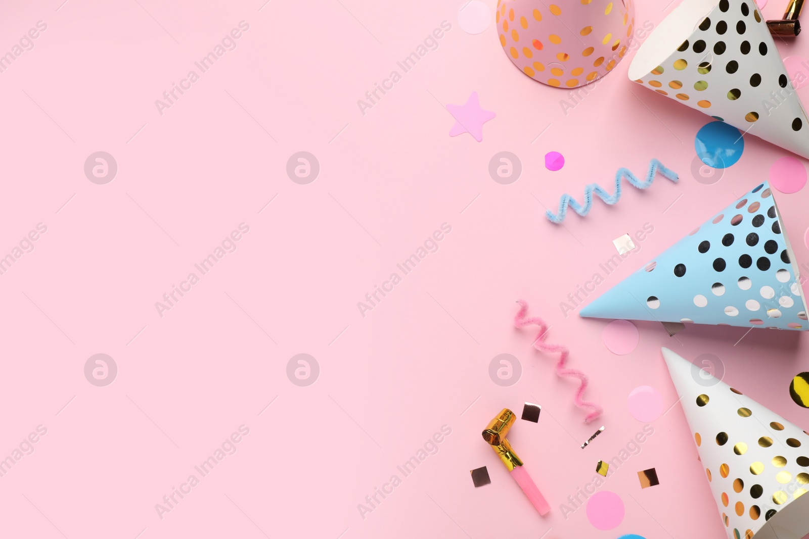 Photo of Flat lay composition with party items on pink background, space for text