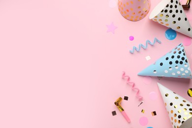 Flat lay composition with party items on pink background, space for text