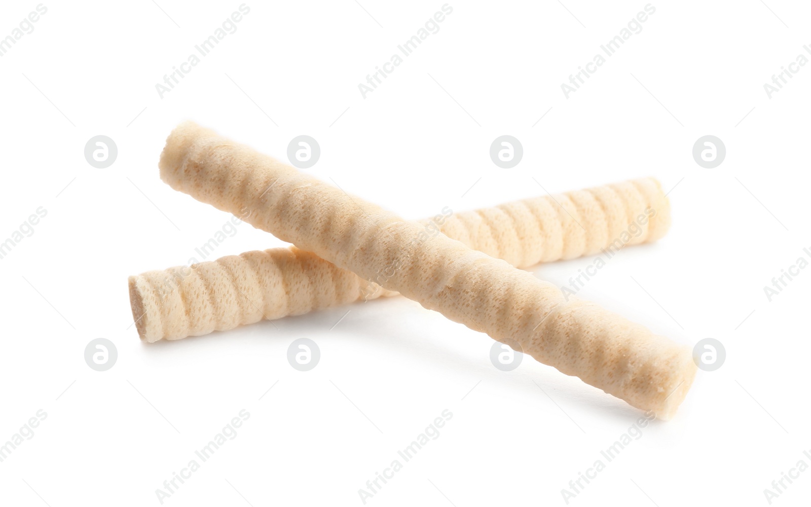Photo of Delicious wafer rolls on white background. Sweet food
