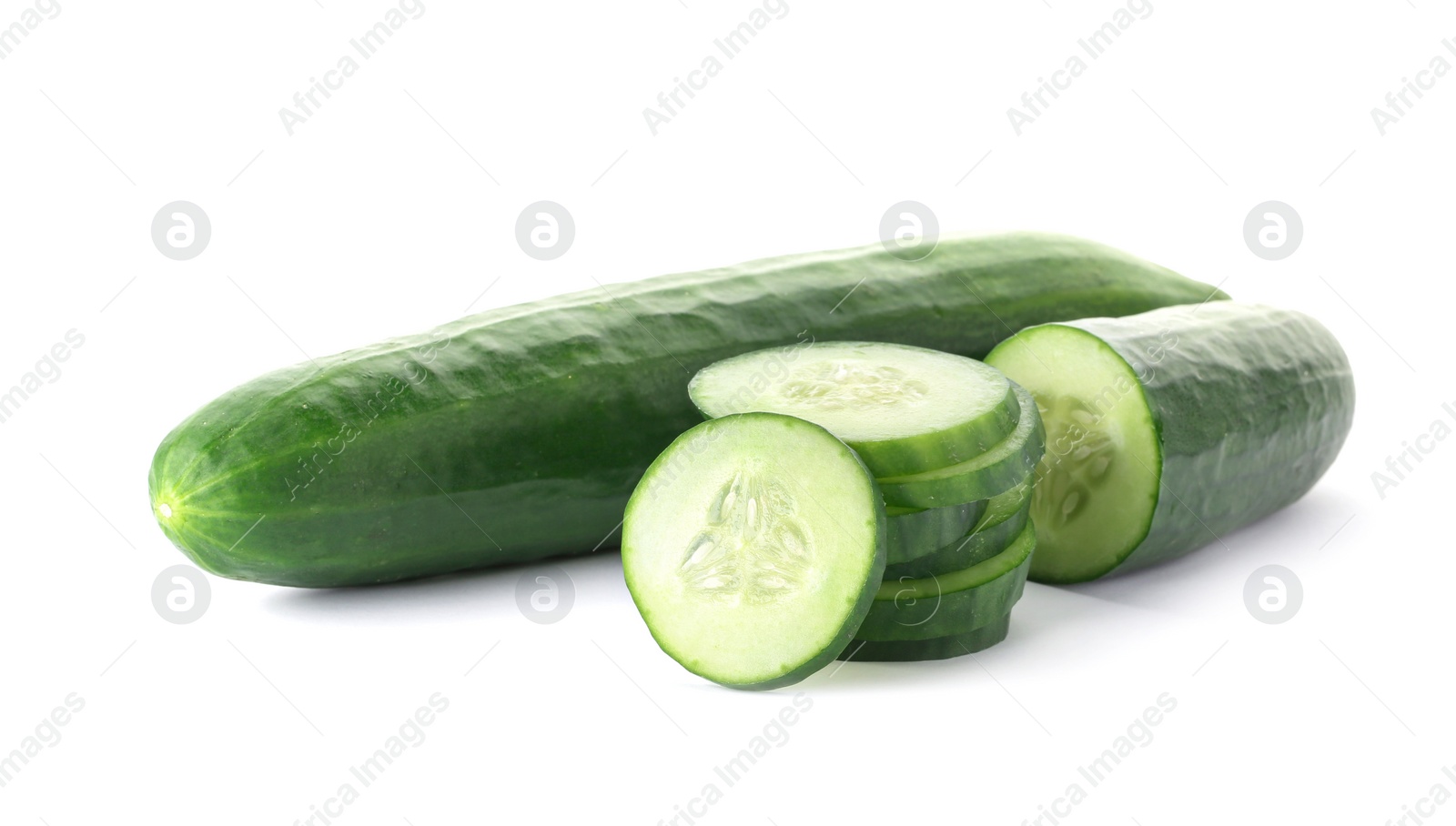 Photo of Whole and sliced fresh cucumbers on white background