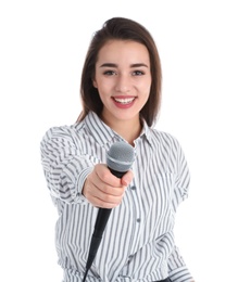 Young woman in casual clothes with microphone on white background