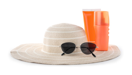 Sun protection products, sunglasses and hat on white background. Beach objects
