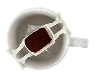 Photo of Cup with drip coffee bag isolated on white, top view