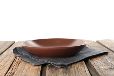 Photo of Empty brown plate and napkin on wooden table against white background