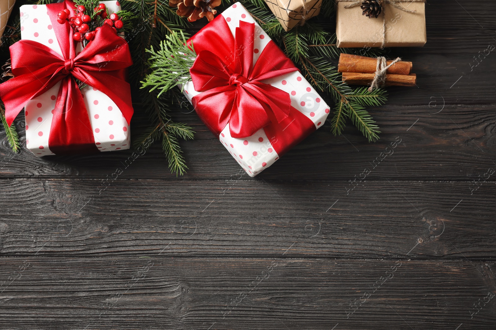 Photo of Flat lay composition with Christmas gifts on wooden background