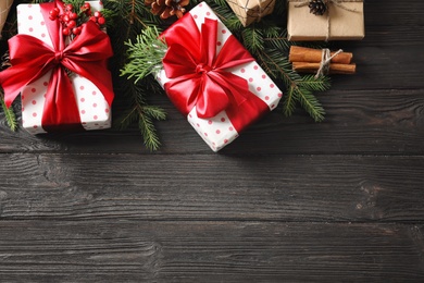 Flat lay composition with Christmas gifts on wooden background