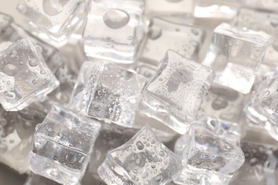 Photo of Melting ice cubes with water drops as background, above view