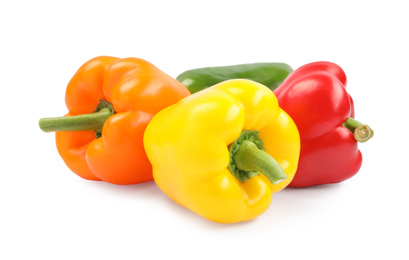 Fresh ripe bell peppers on white background