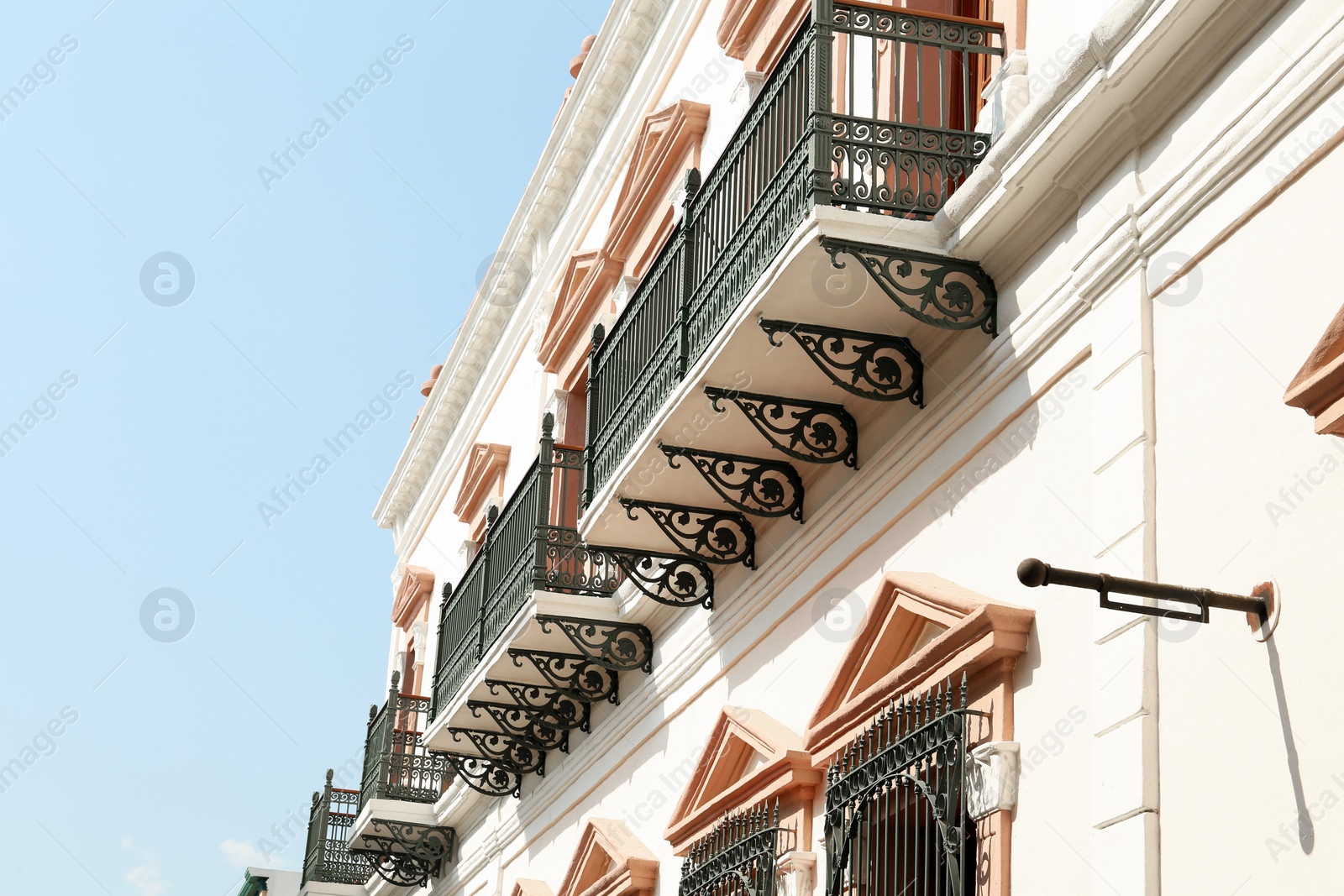 Photo of Exterior of beautiful building with windows and balconies