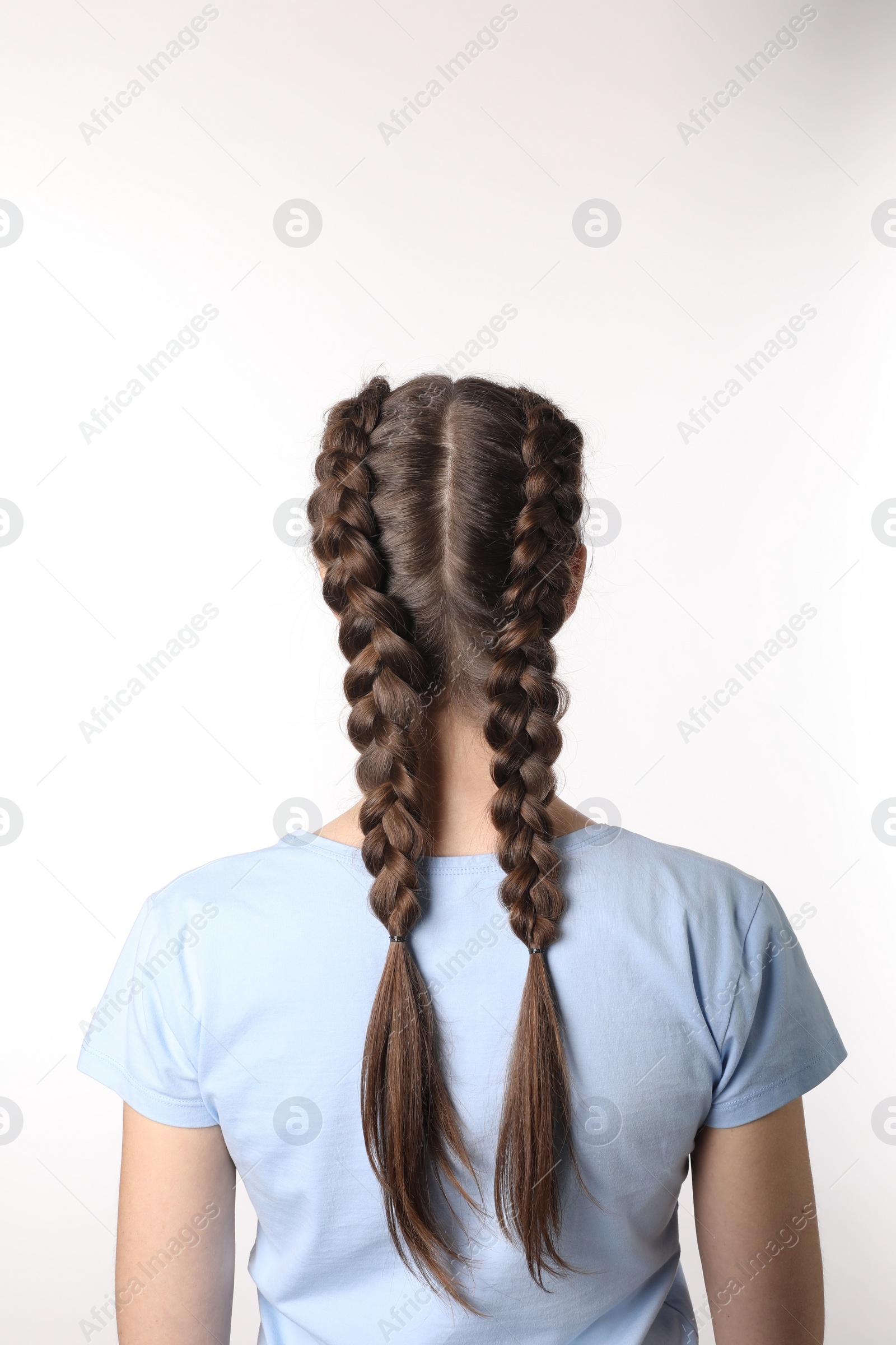 Photo of Woman with braided hair on light background, back view