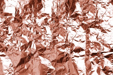 Image of Crumpled rose gold foil as background, closeup view