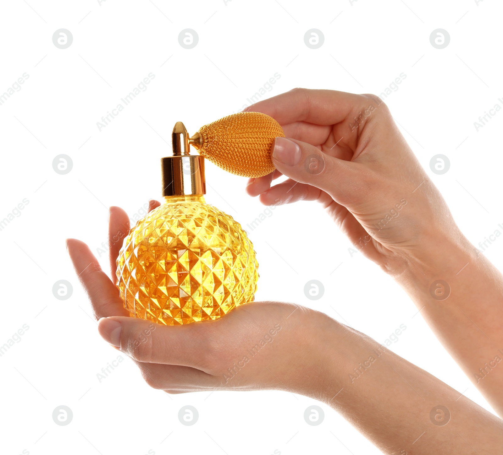 Photo of Woman holding bottle of luxury perfume on white background, closeup