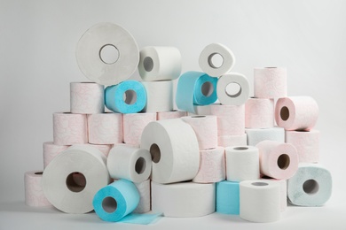 Photo of Pile of toilet paper rolls on white background