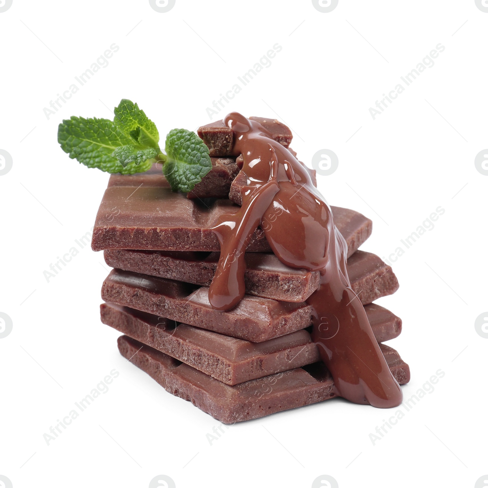 Photo of Pieces of milk chocolate with tasty paste and mint isolated on white