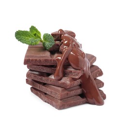 Photo of Pieces of milk chocolate with tasty paste and mint isolated on white