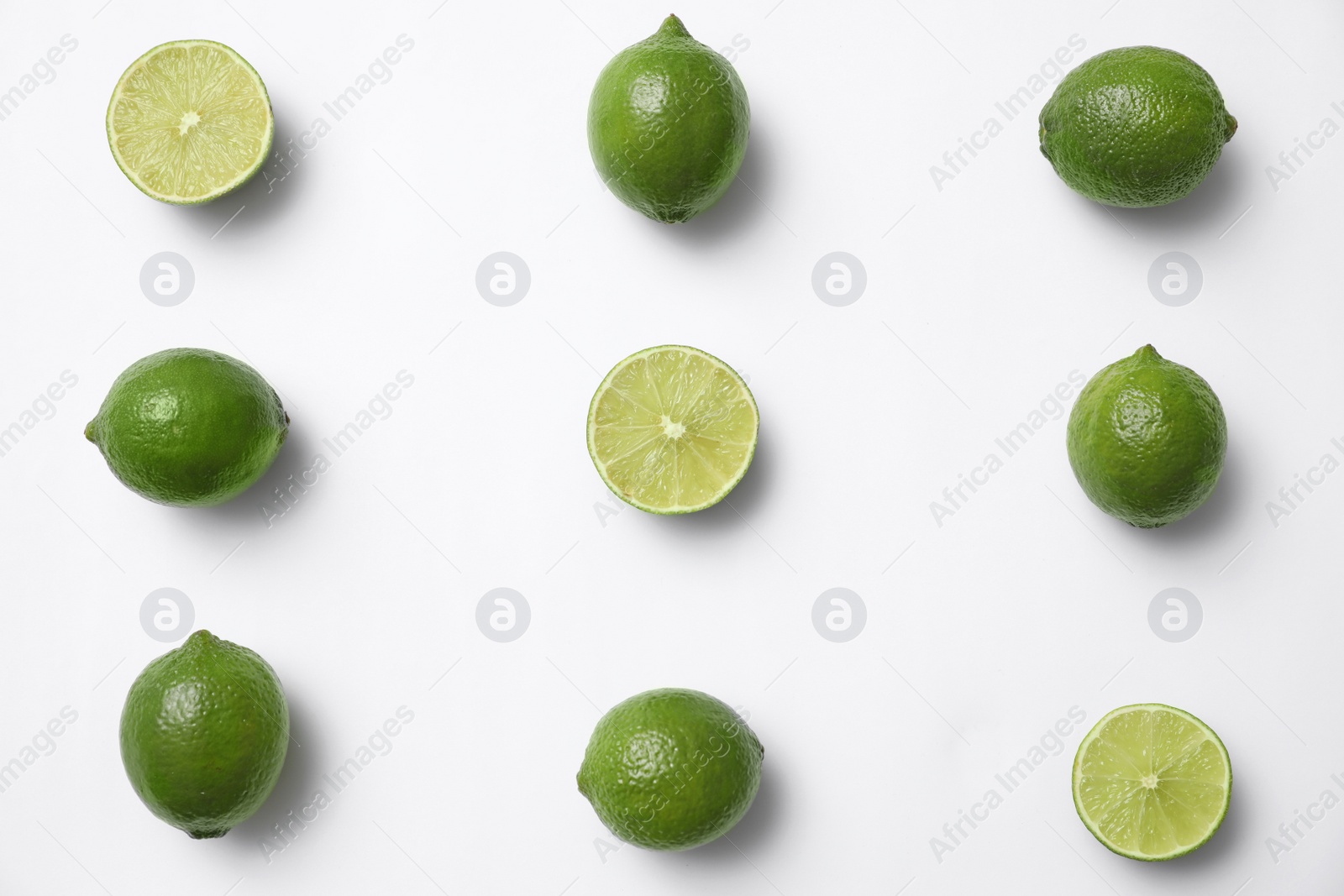 Photo of Flat lay composition with fresh juicy limes on white background