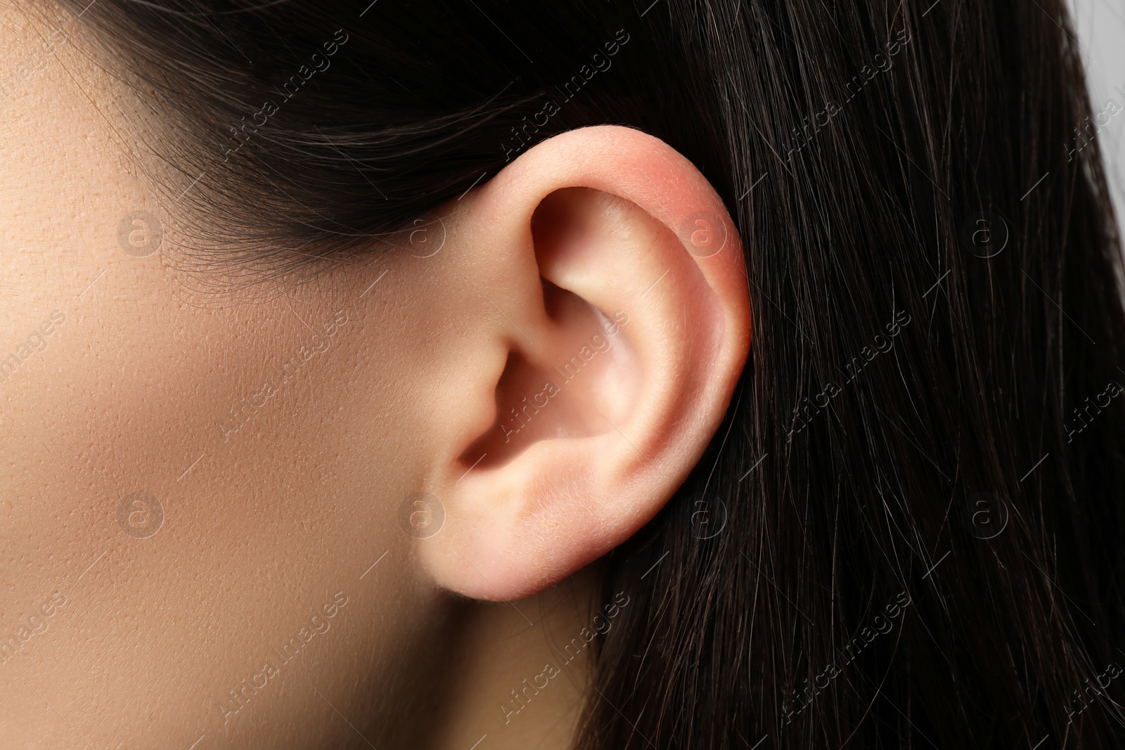 Photo of Closeup view of woman, focus on ear