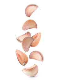 Image of Set of falling garlic cloves on white background