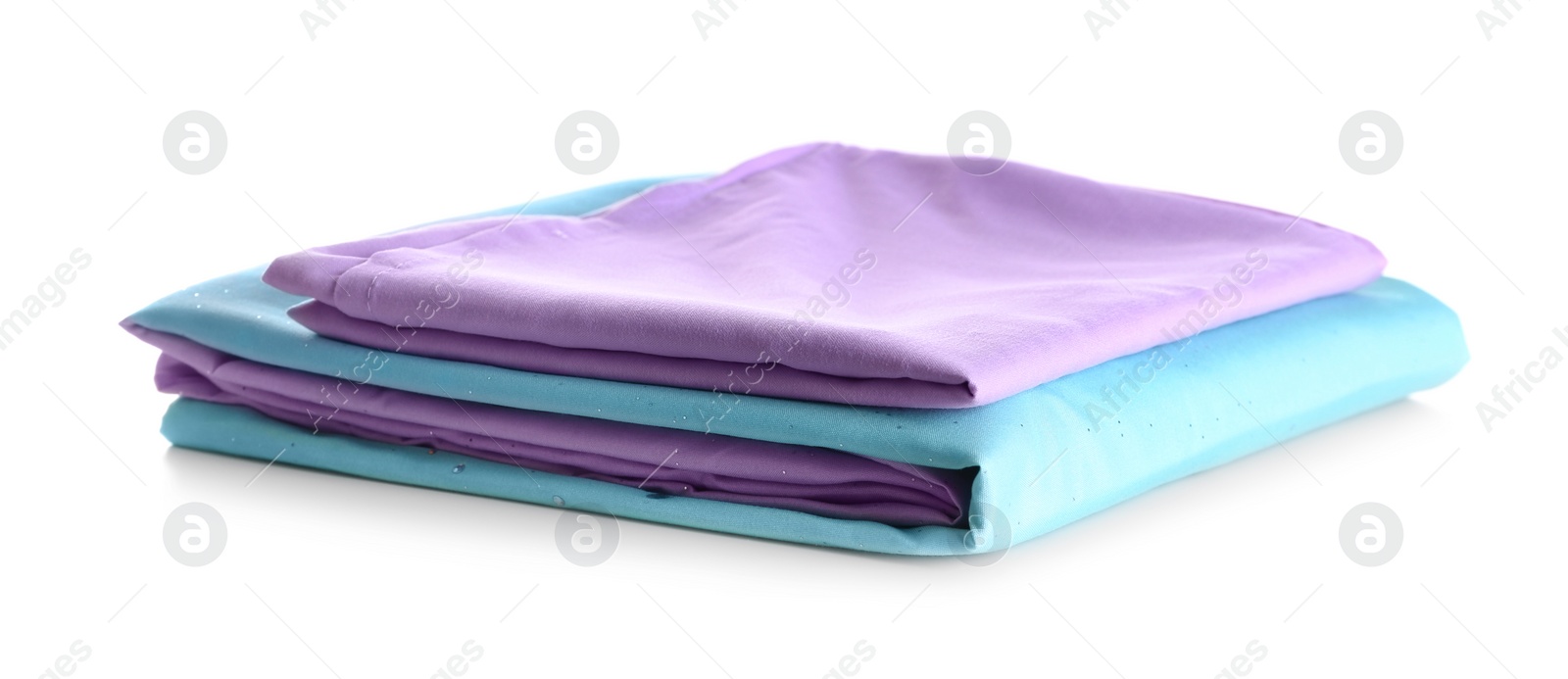 Photo of Stack of clean bed sheets isolated on white