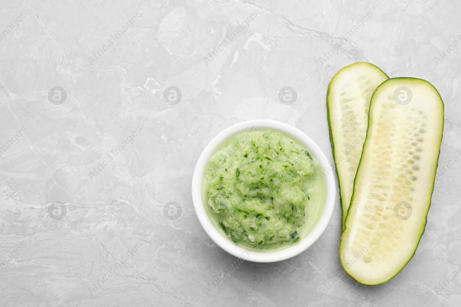 Photo of Handmade face mask and fresh ingredients on light marble table, flat lay. Space for text