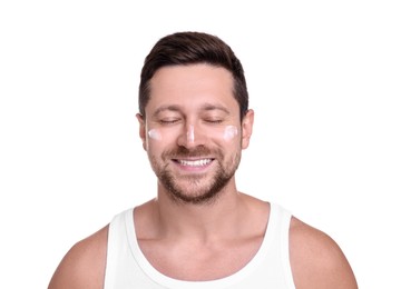 Handsome man with sun protection cream on his face against white background