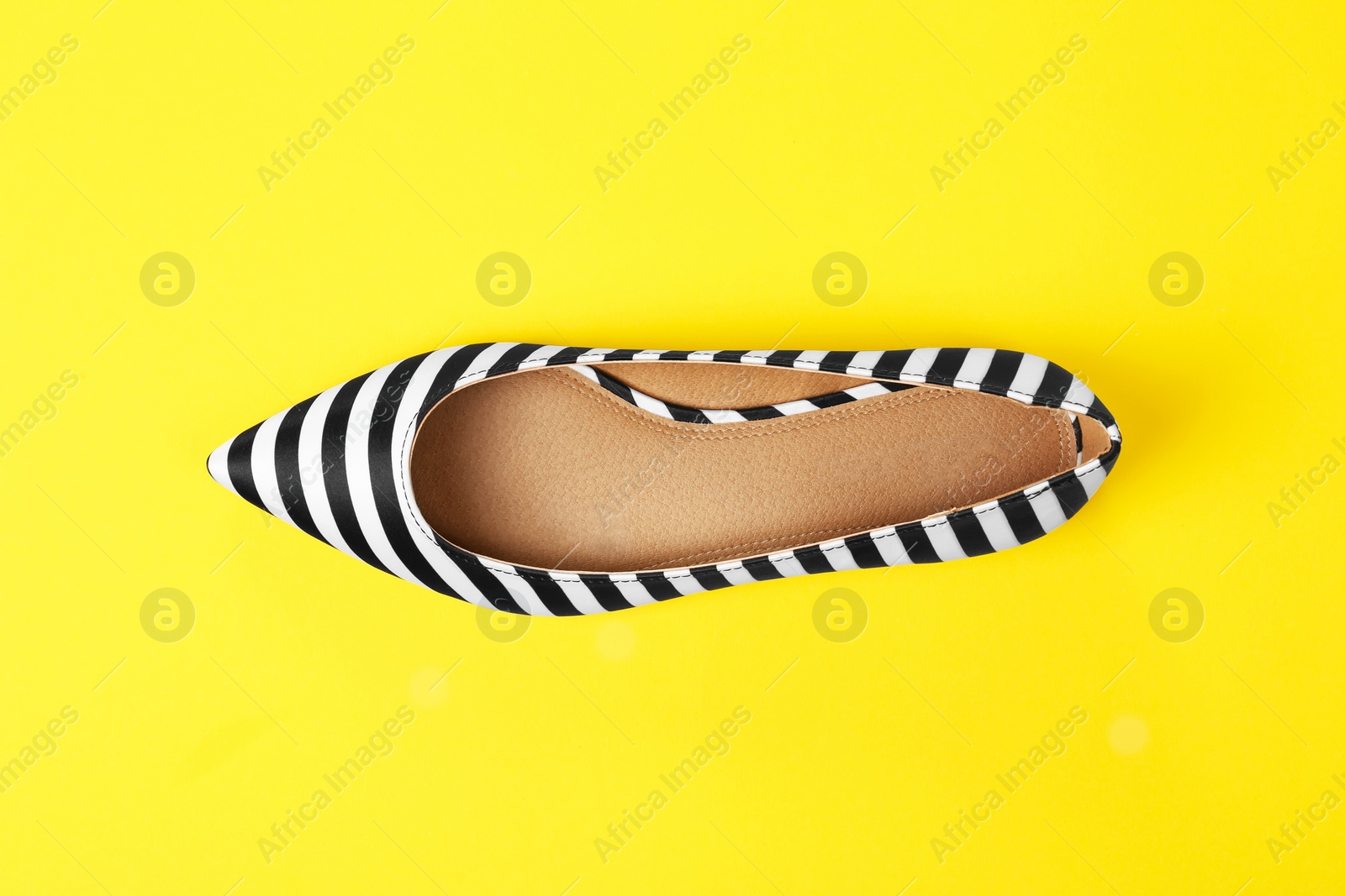 Photo of Female shoe on color background, top view