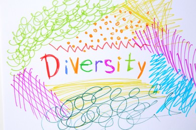 Photo of Word Diversity and colorful marker scribbles on white background, top view