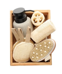 Photo of Set of toiletries with natural loofah sponges in wooden crate isolated on white, top view