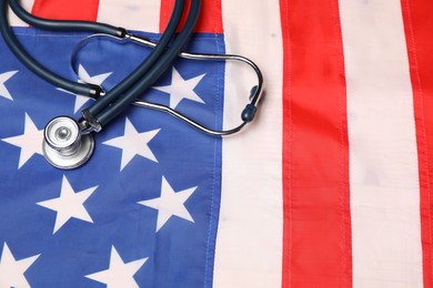 Photo of Stethoscope on USA flag, above view. Health care concept